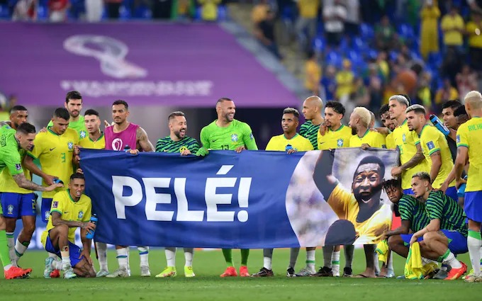 Brazilian players brought a banner bearing Pele's name after their win against South Korea